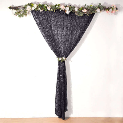 Black decorative curtain with floral accents on top