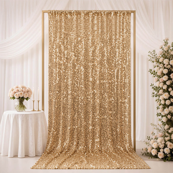 Gold sequin wedding backdrop with white floral decor and draped curtains