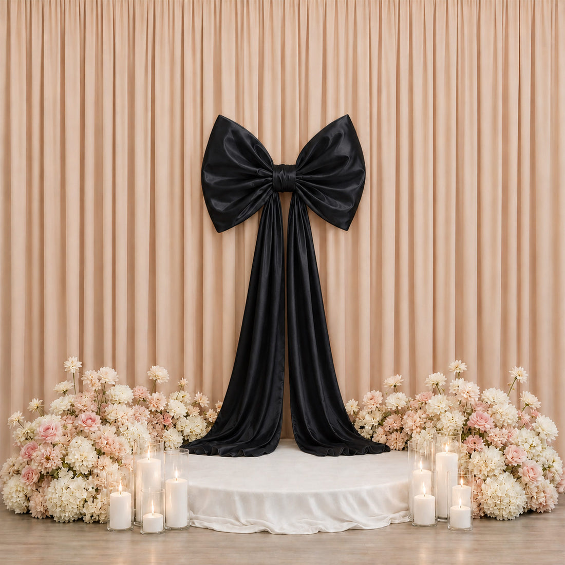 Elegant black bow wedding backdrop with pastel flowers and candles