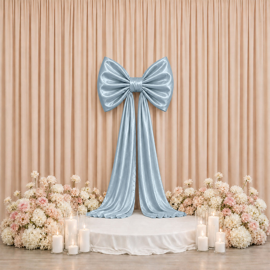 Elegant pastel blue bow stage backdrop with flowers and candles