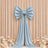 Elegant silver satin bow backdrop with floral decor and draped ribbon.