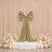 Elegant blush floral wedding backdrop with gold velvet bow and candles