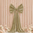 Elegant gold velvet bow drape backdrop with pastel flowers for event decor