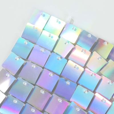 Holographic square tiles arranged in a grid pattern.