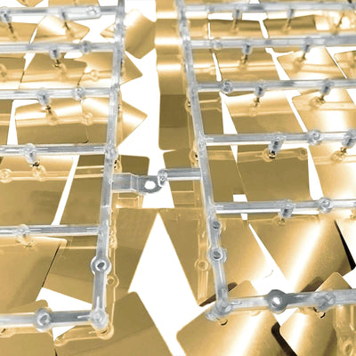Transparent plastic model parts arranged on a white background