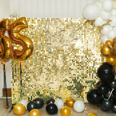 Gold and black balloon decorations with a shimmering backdrop for celebrations.