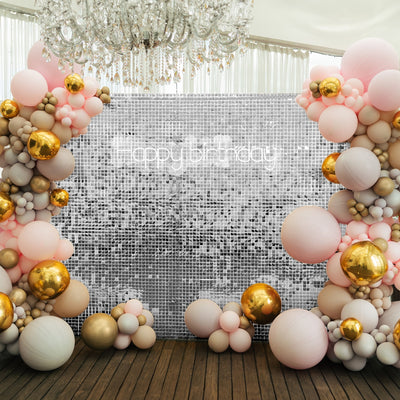 Birthday party backdrop with pink, gold, and white balloons.