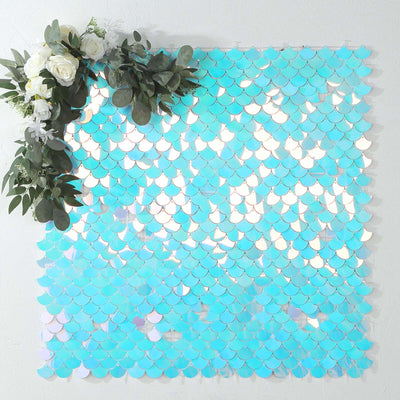 Turquoise sequin backdrop with floral arrangement