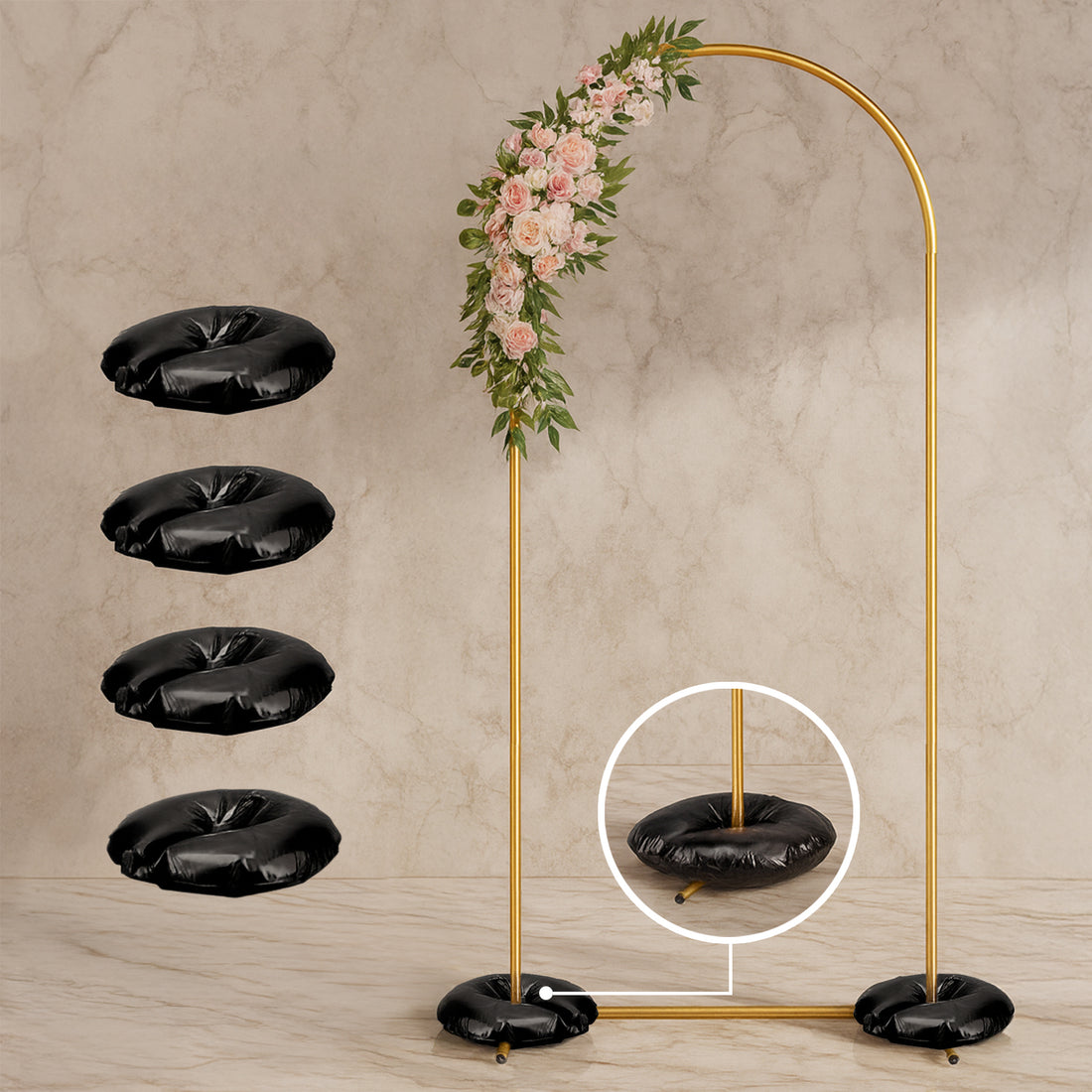 Gold wedding arch with floral accents and four black base cushions