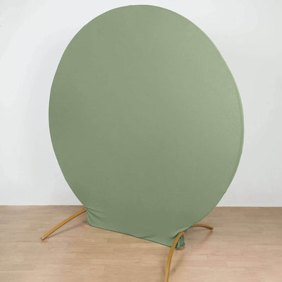 Round green backdrop stand for photography, studio-style isolation shot.