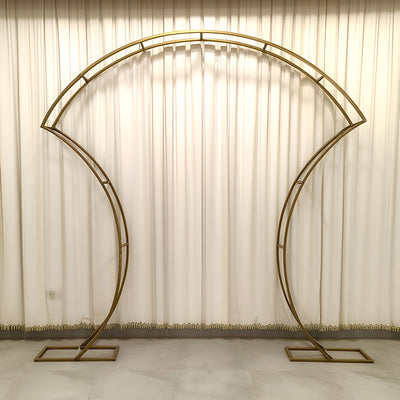 Elegant metallic archway backdrop for events and photos.