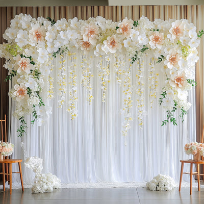 Elegant floral backdrop with large white and peach flowers for events or photography.