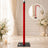 Red velvet rope stanchion with black base in elegant event venue