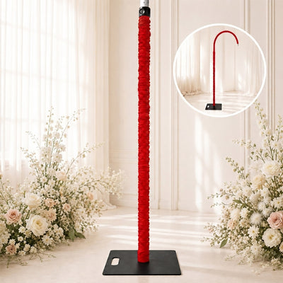 Red wedding umbrella stand with black base in elegant floral backdrop