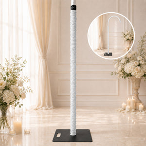 White adjustable microphone stand on black base in elegant wedding venue