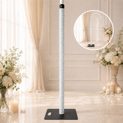 White adjustable microphone stand on black base in elegant wedding venue