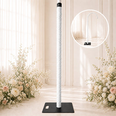 White adjustable umbrella stand pole with weighted base in elegant floral setting