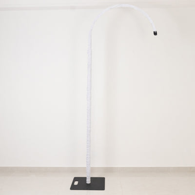 White curved floor lamp with a black base