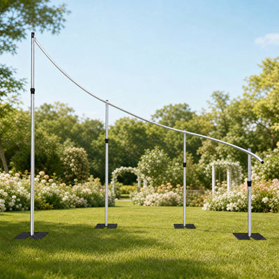 Curved stainless steel garden pergola frame in a landscaped outdoor setting