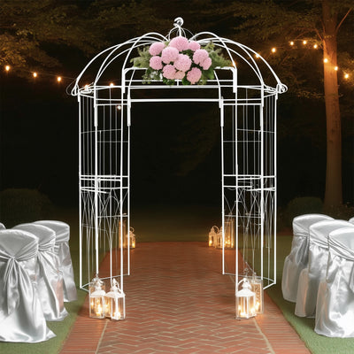 White wedding gazebo with floral arrangement, surrounded by lanterns and chairs.