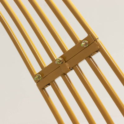 Close-up of a yellow chair's metal frame and connectors.