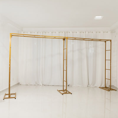 Gold clothing rack with a minimalist design on a white background.