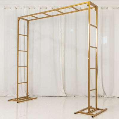 Gold metal photo backdrop stand with adjustable height and sturdy base.