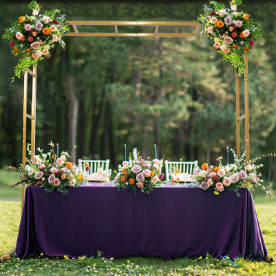 Elegant wedding reception table adorned with floral arrangements and chairs.