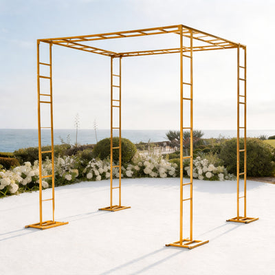 Yellow wedding arch against ocean backdrop, perfect for outdoor ceremonies.