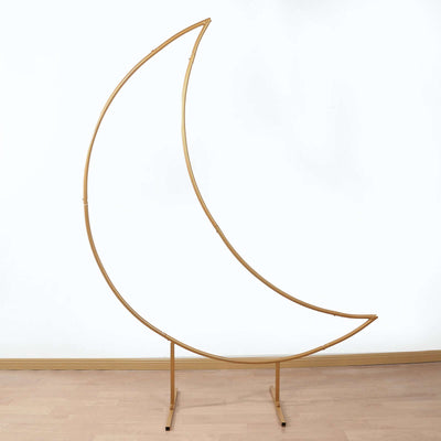 Gold crescent moon decor display stand on a plain background