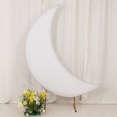 Large crescent moon backdrop with floral arrangement at the base.