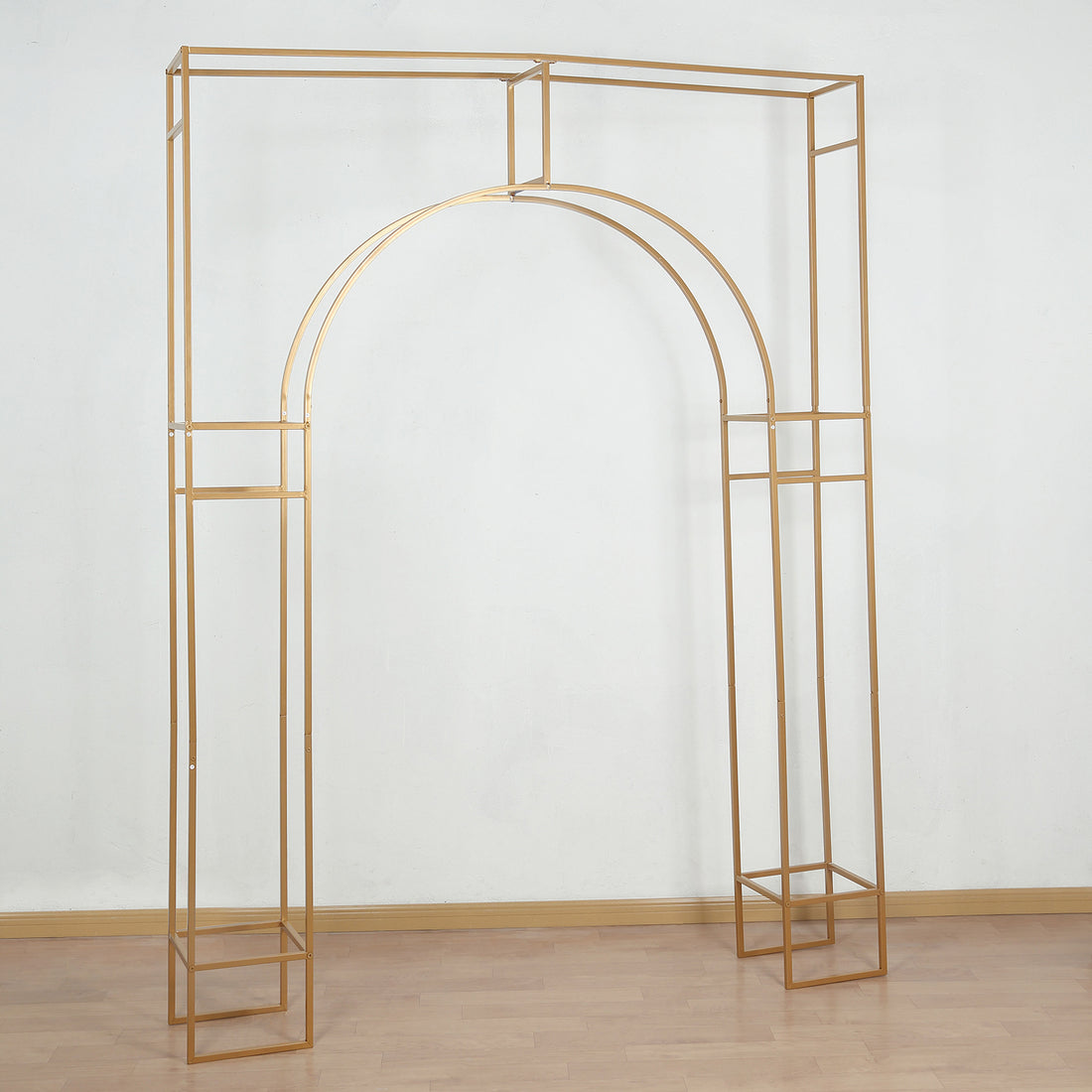 Gold metal archway display stand on a plain background