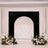 Elegant wedding backdrop with black arch and pastel floral arrangements