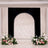 Elegant wedding arch with floral arrangements and black backdrop backdrop
