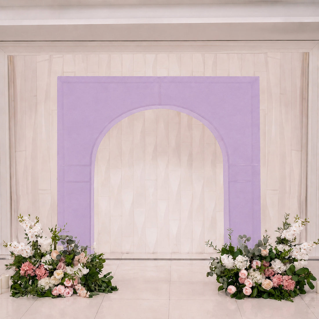 Lavender arch wedding backdrop with pastel floral arrangements