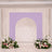 Lavender arch wedding backdrop with pastel floral arrangements