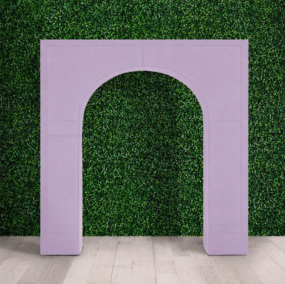 Lavender arch backdrop frame against green hedge wall and wood floor