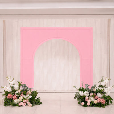 Pink arch wedding backdrop with white flowers and floral arrangements