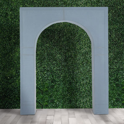 Blue archway structure against a green foliage backdrop.