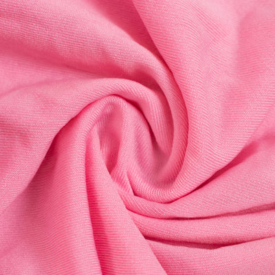 Pink fabric texture with soft, smooth folds.
