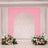Pink floral wedding arch backdrop with white curtain and flower arrangements