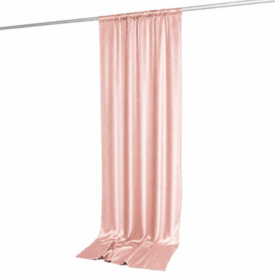 Pink satin curtain panel with rod pocket, hanging on a rod, on white background
