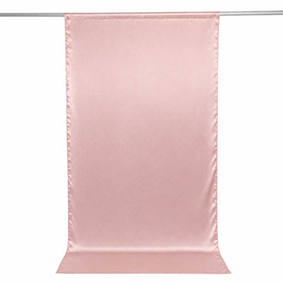 Pink satin curtain panel hanging on a rod, isolated on white background