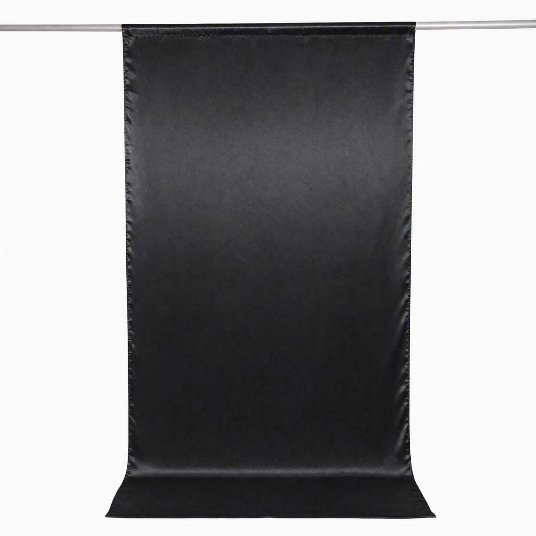Black photography backdrop curtain on hanging rod, seamless studio background