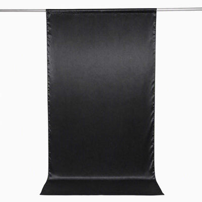 Black photography backdrop curtain on hanging rod, seamless studio background