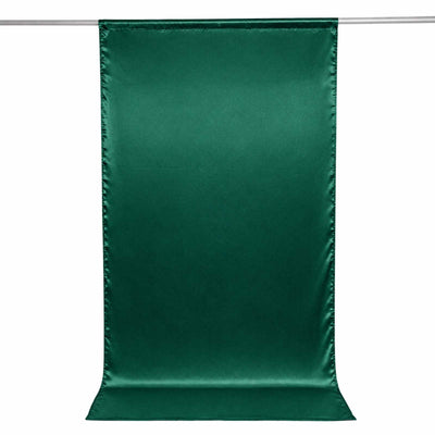 Green satin backdrop banner hanging on a rod, isolated on white background