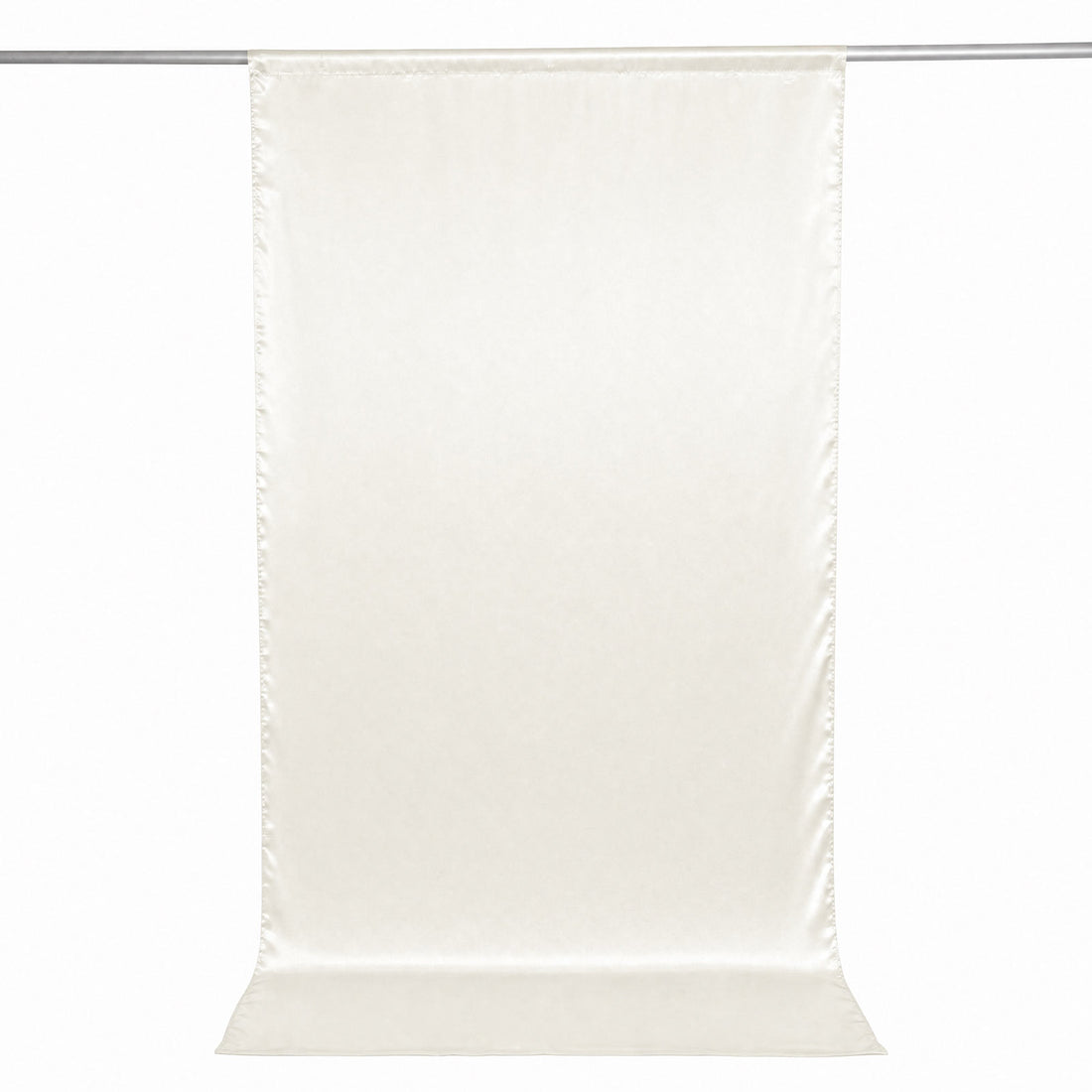 Cream sheer curtain panel hanging on a rod, minimalist window treatment