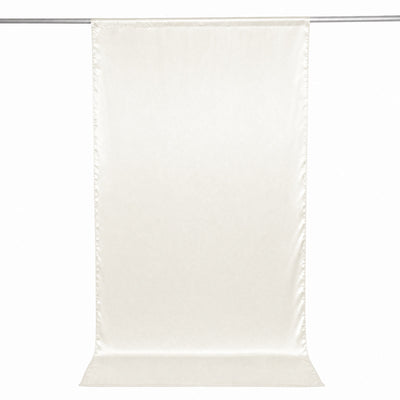 Cream sheer curtain panel hanging on a rod, minimalist window treatment