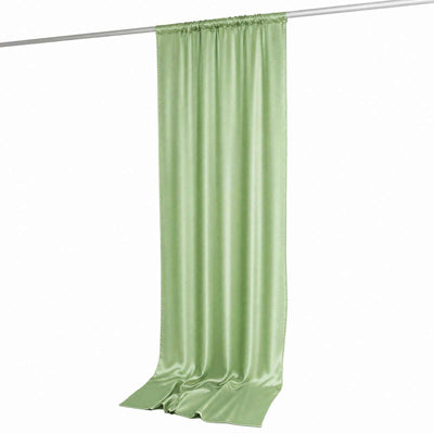 Light green satin curtain panel hanging on rod, isolated on white
