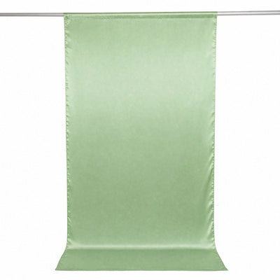 Light green satin draped fabric panel hanging on a rod